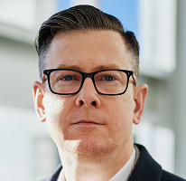 Alexander Hughes, PDG d'une entreprise spécialisée dans le crypto-trading, portrait